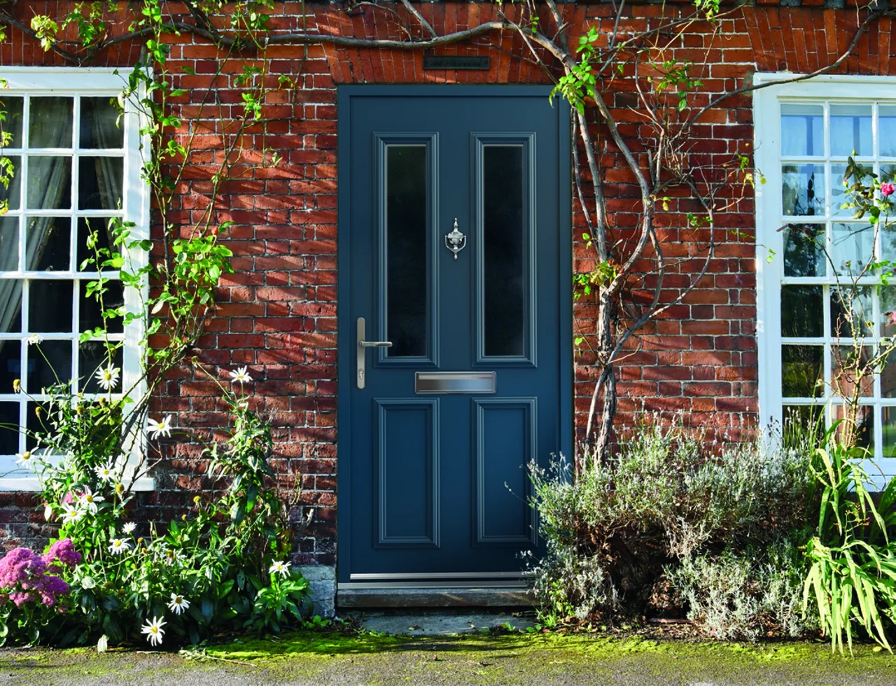 Smart Signature aluminium entrance door in a brick home